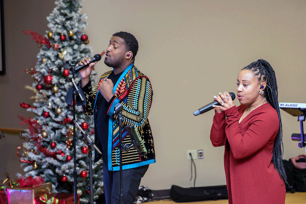 singers at holiday hop event